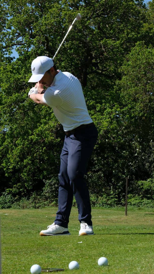 Huw Williams at the top of the backswing, course swing